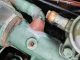 Repair made to a hole in an engine heat exchanger manifold using epoxy putty