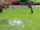 A wet patch in a garden can be a sign of an underground leak